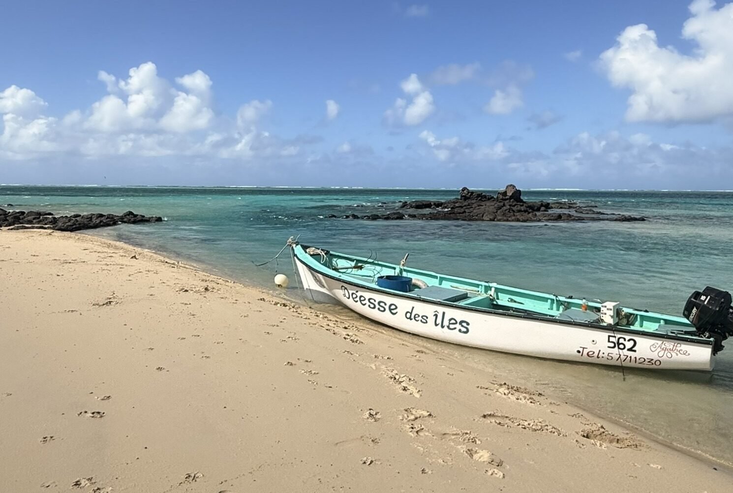 Small fishing boat moored on a quiet beach in Rodrigues Island