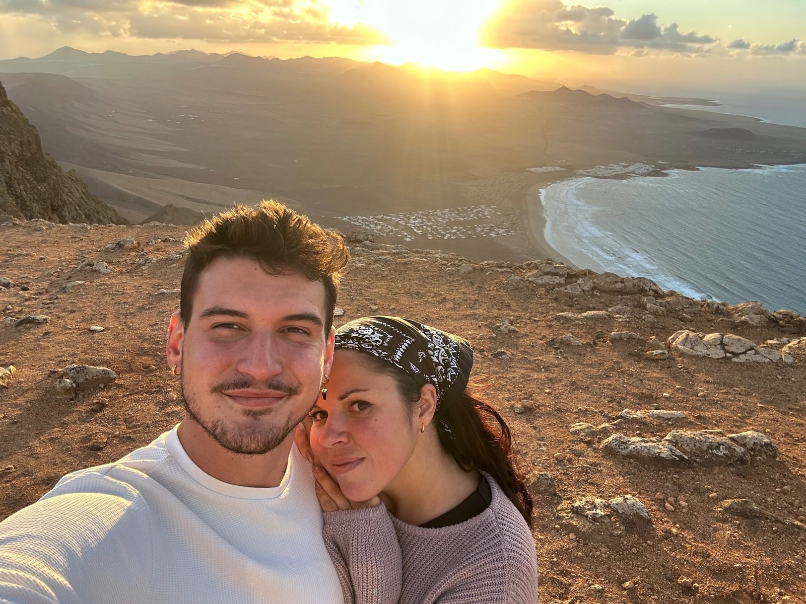 Eli and Tom at sunset above the volcanic coast of Lanzarote